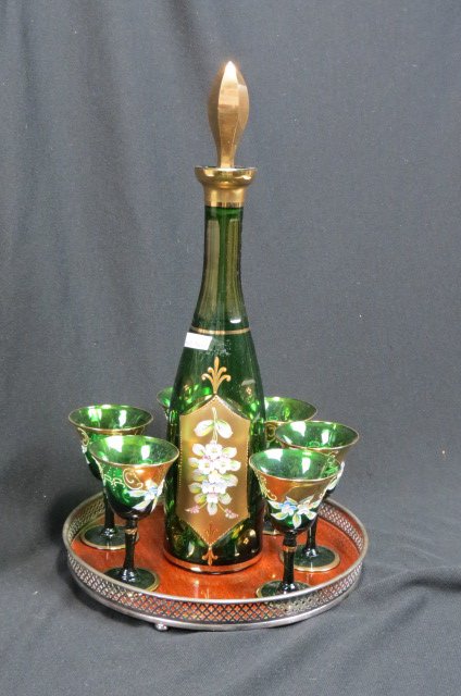 Emerald Enameled & Cut Glass Liquor Set,: decanter with six wine glasses, floral with heavy gold work, emerald then medallions cut back to amber, with a silverplate gallery tray.