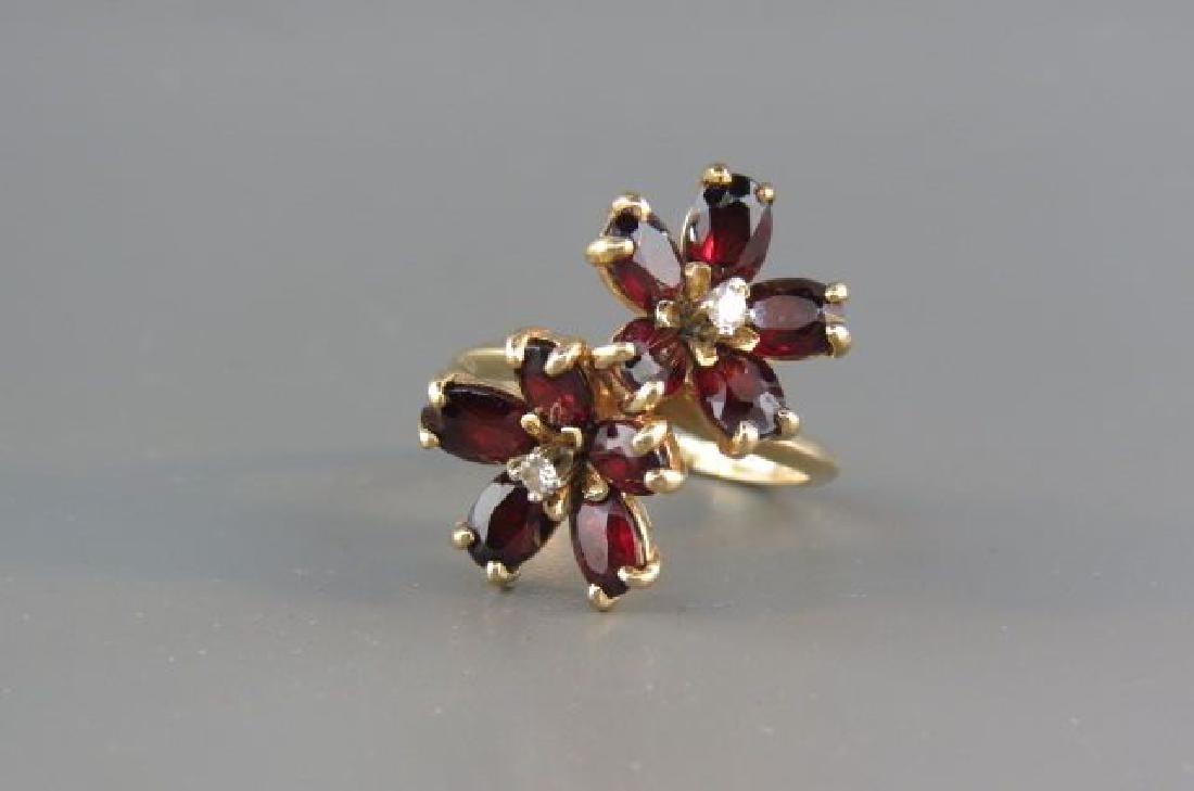 Garnet & Diamond Ring,: Garnet & Diamond Ring, 10 rich oval gems and two round diamonds in 14 yellow gold double flower setting, currently size 7.5