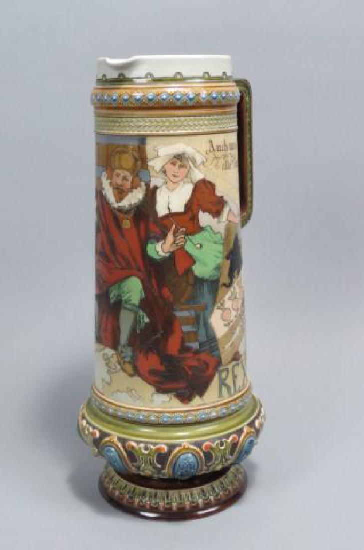 Mettlach Pottery Tall Tankard,: Mettlach Pottery Tall Tankard, etched with scenes of Gambrinus on throne, jeweled base, signed Schlitt, open top, 1.5 liter, 13" tall, scarce.