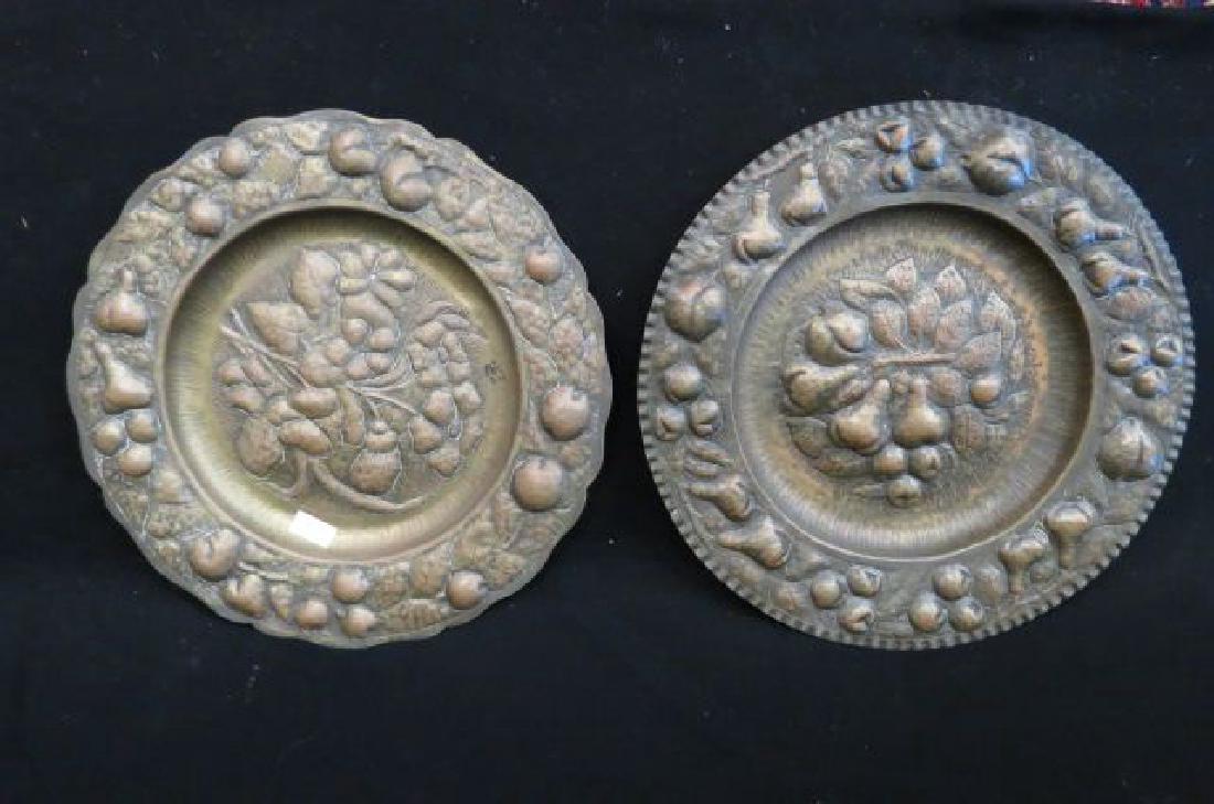Pair of Arts & Crafts Copper Chargers,: Pair of Arts & Crafts Copper Chargers, blown out fruit and floral, hand hammered, 18" diameter, circa 1910.