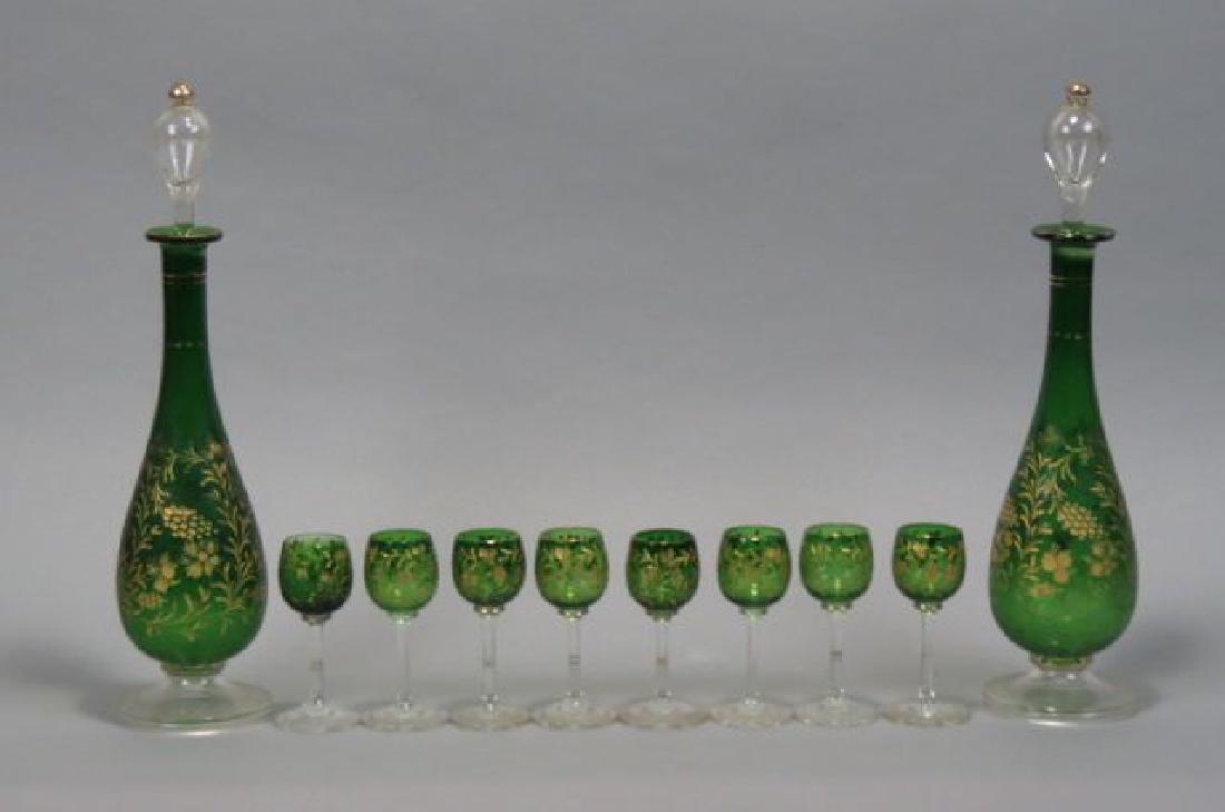 Emerald Glass Pair of Decanters & 8 Cordials,: Emerald Glass Pair of Decanters & 8 Cordials, gold decorated intaglio cut floral, 14" decanters.