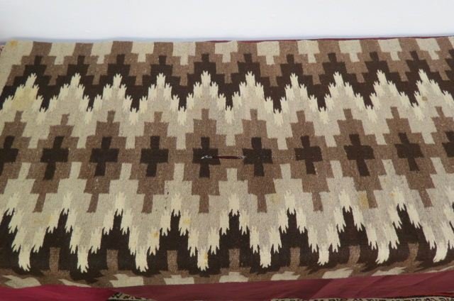 Navajo Indian Rug,: geometric and bearpaw type designs, browns and grey, 3' X 5'5".