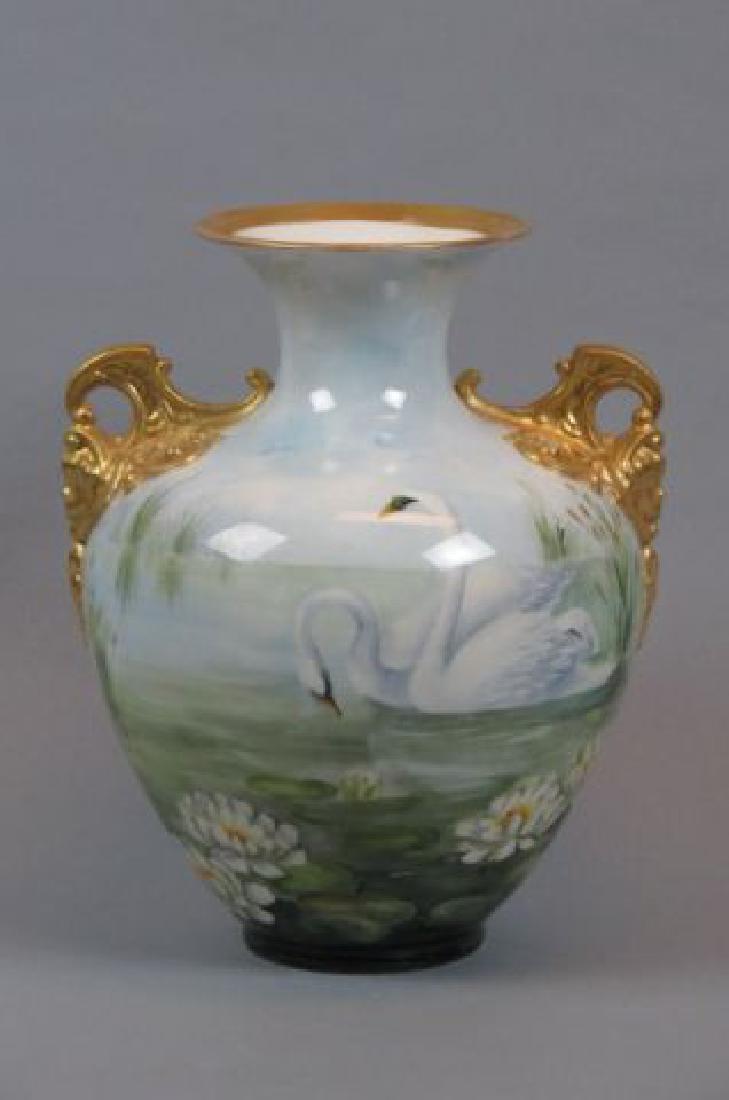 Lenox Belleek Handpainted Porcelain "Swans" Vase,: swans swimming among the water lillies and cattails, elaborate gold handles, artist signed. N. Harvey, 12".....Lenox resolved to become a potter early in his boyhood. Starting in 1875 at the age of si