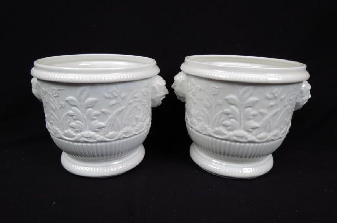 Pair of Limoges Porcelain Planters or Wine Coolers: specially made for Metropolitain Museum of Art, copy of a 1725-1740 pair, embossed floral and faces as handles, 7", excellent.