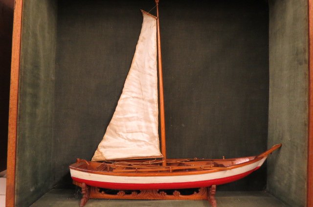Wooden Model of a Sailboat in Wall Cabinet,: model is 16" long, 16" tall, cabinet is 20"X 18"X 6".