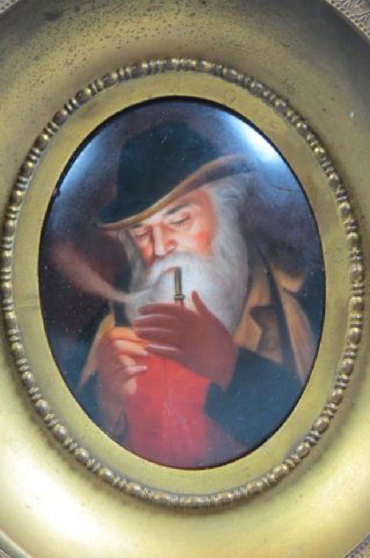 Painting on Porcelain Plaque "Lighting his Pipe",: older gentleman, oval, plaque size 2 1/2" X 3 1/2", in metal frame, 5" X 6" overall.