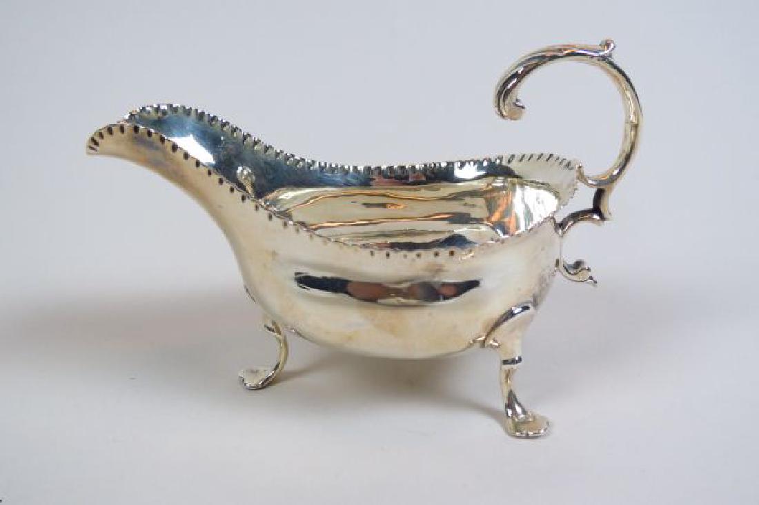 1772 English Sterling Silver Sauce Boat,: footed, hallmarks of London, 1772, maker William Shaw, no monogram, 2 1/2" X 5", 98 grams.