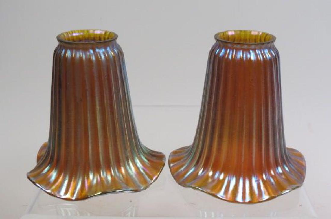 Pair of Art Glass Shades,: golden iridescent, ribbed floraform, 5" diameter, 5 1/4" long, 2 1/8" fitter.