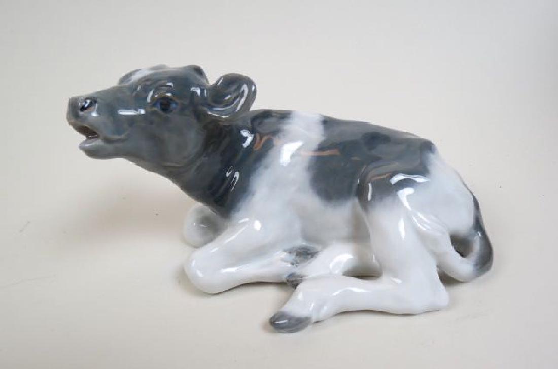 Royal Copenhagen Porcelain Figurine of a Cow: at Rest, #1072, 4" X 6 1/2", excellent.