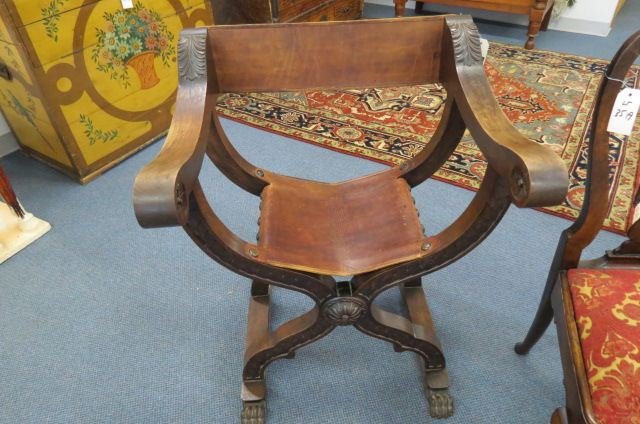 Savonarola Chair,: also called scissors or "X' chair, folding leather and wood.
