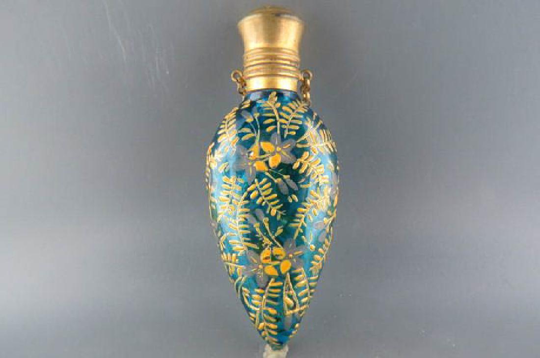 Victorian Enameled Art Glass Perfume Bottle,: brass cap and finger ring, 3 1/2" long, yellow floral on sapphire blue, still has original stopper, attributed to Moser, circa 1880.