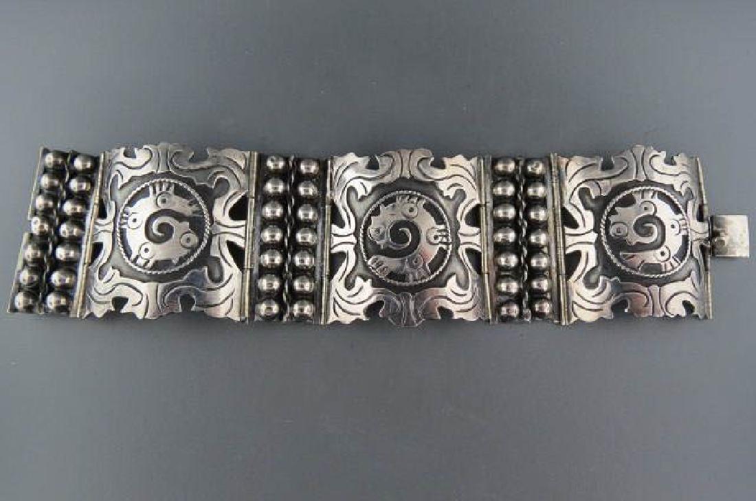 Vintage Mexican Sterling Silver Bracelet,: signed VCC, Aztec style designs, ball & cable between, 1 5/8" wide, 6 1/2" long.