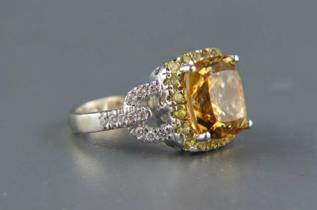 Citrine & Diamond 14K Gold Ring,: rich vibrant cushion cut gem weighing 4.66 carat, surrounded by 20 round fancy yellow diamonds weighing .25 carat and 12 round white diamonds on sides totaling .10 carat in 14k white gold, with apprai