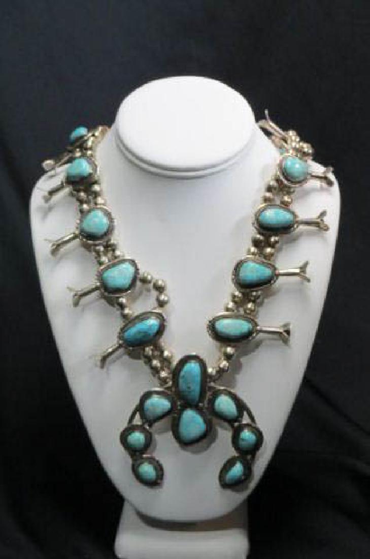 Navajo Squash Blossom Necklace Sterling Turquoise: with 18 rich blue cabochons, 10 blossoms, 28" long plus horseshoe pendant.