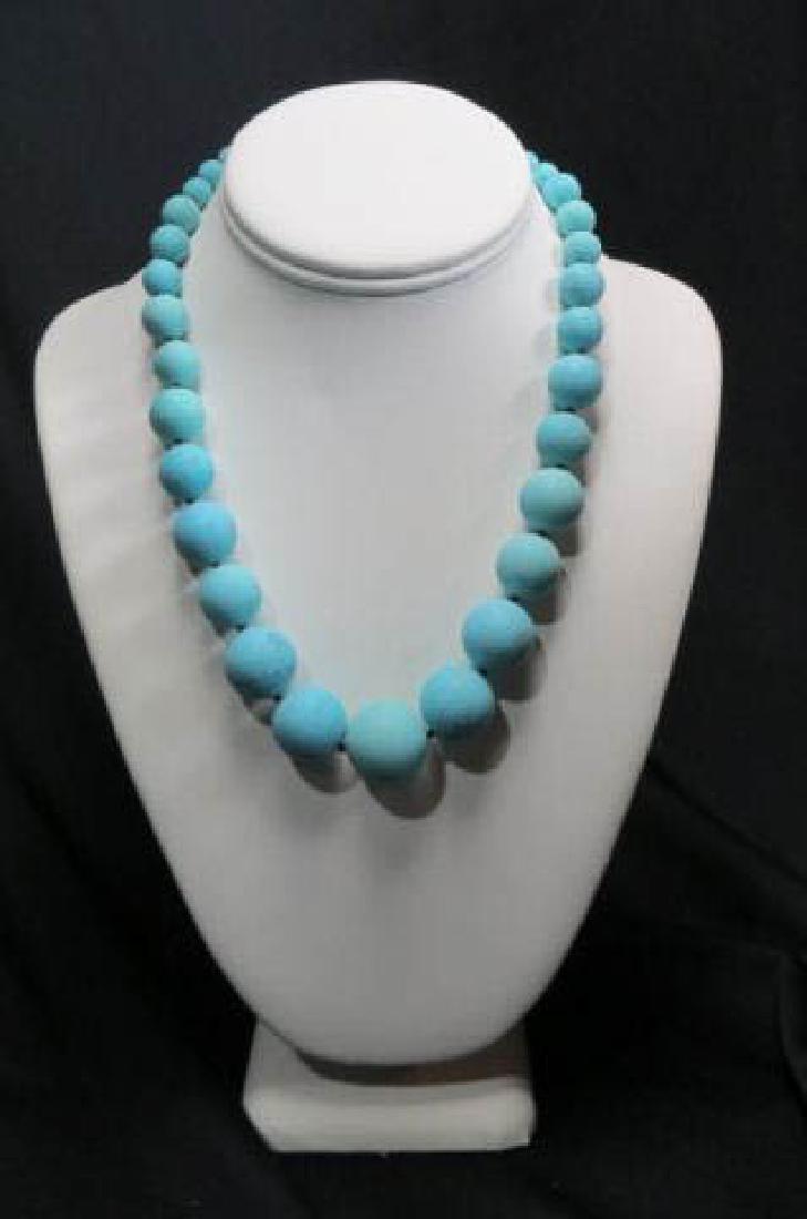 Turquoise Necklace,: 35 graduated beads, 6 to 20mm, sterling clasp, up to 20" long.