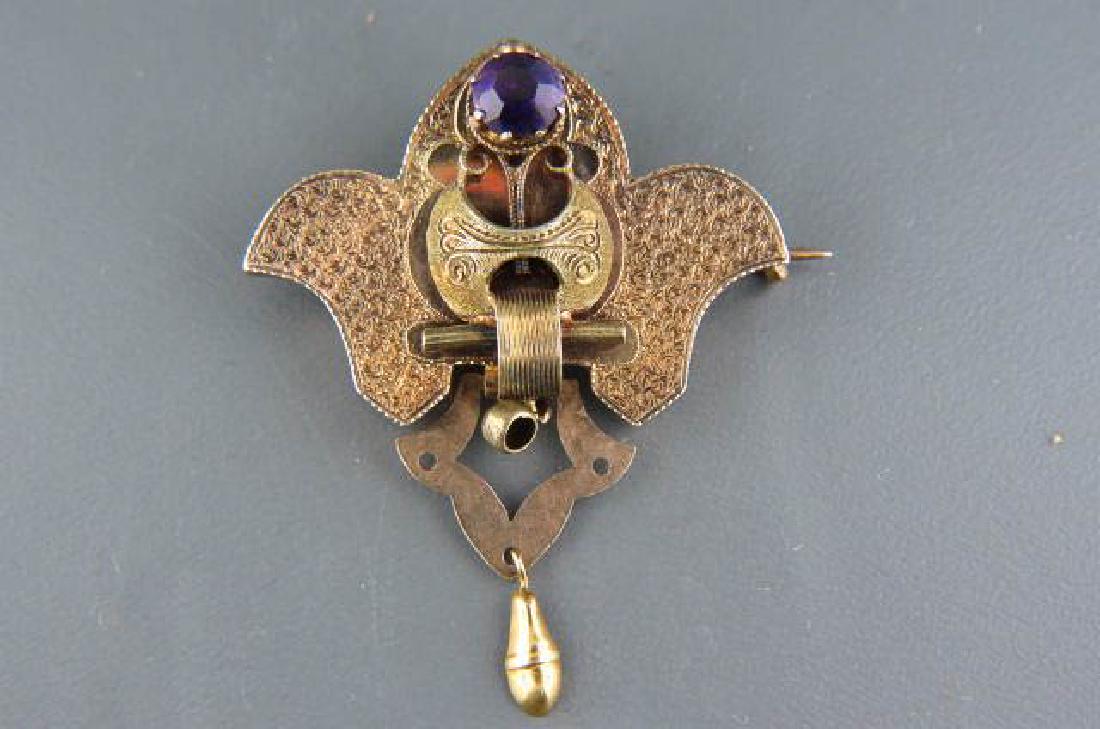 14k Gold Victorian Brooch,: with amethyst, Etruscan style, fancy engraving, marked 14k yellow gold, with hanger, 1 3/8" wide, 1 3/4" long, circa 1870s, 5.6 grams.