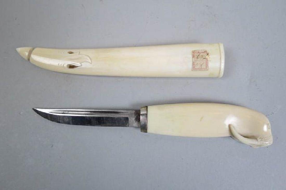 A Norwegian Carved Walrus Ivory Knife & Sheath,: late 19th century, single edge 4" blade, original ivory scabbard (chip), overall 10 1/2" long.