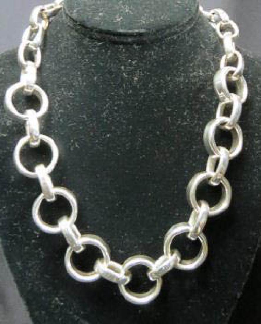 Sterling Silver Necklace,: circle & oval design, approx. 1" circles, toggle clasp, 69 grams, 21" long.