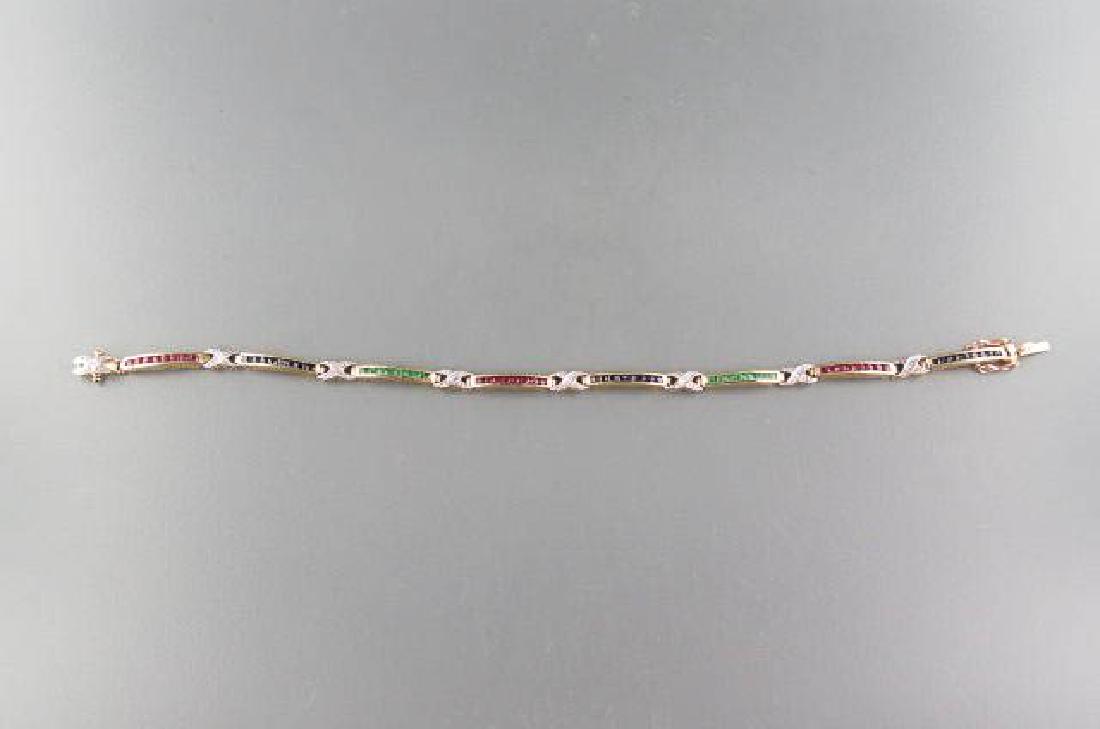 Ruby, Emerald, Sapphire & Diamond Bracelet,: 80 round gems in all totaling 2.67 carats, 10k yellow gold, with appraisal of $1140.00, 7" long.