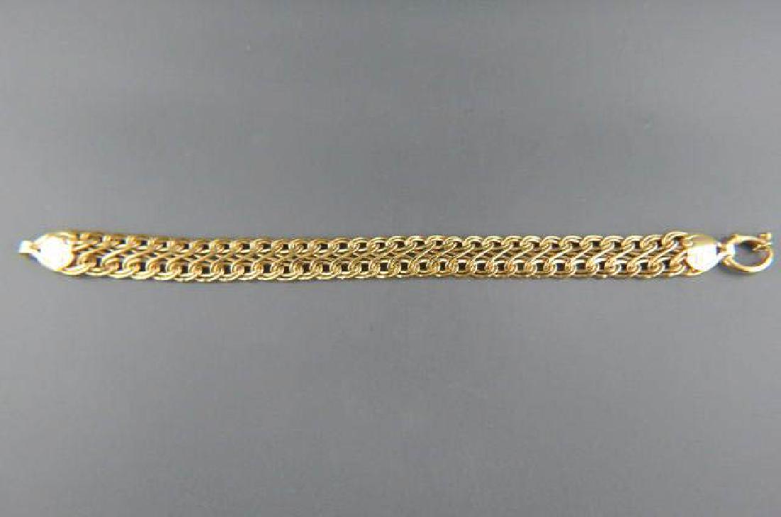 14k Gold Bracelet,: braided design, 21/2" wide, 7 1/2" long, Italian designer, 8.2 grams.