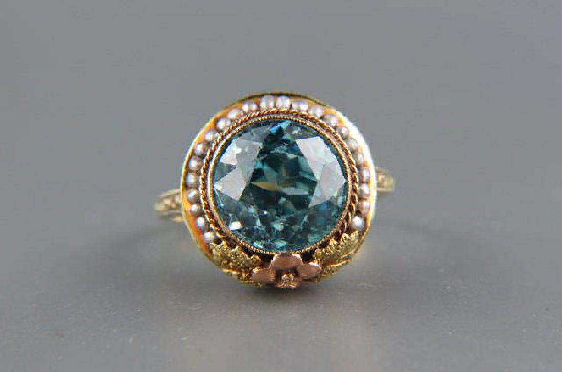 Natural Blue Zircon & Pearl 14K Gold Ring,: vivid round gem weighing 8.10 carats surrounded by seed pearls in 14k yellow & rose gold Art Deco setting, with appraisal of $4610.00, pat'd 1919, currently size 7 1/2.