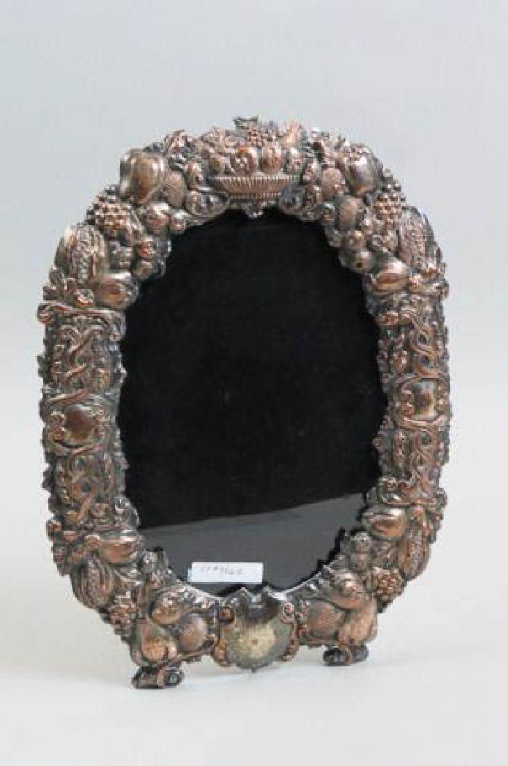 19th Century Silver on Copper Picture Frame,: elaborate bas-relief fruit dicor, oval, would hold a 7" x 10" image, 10" x 14" overall.