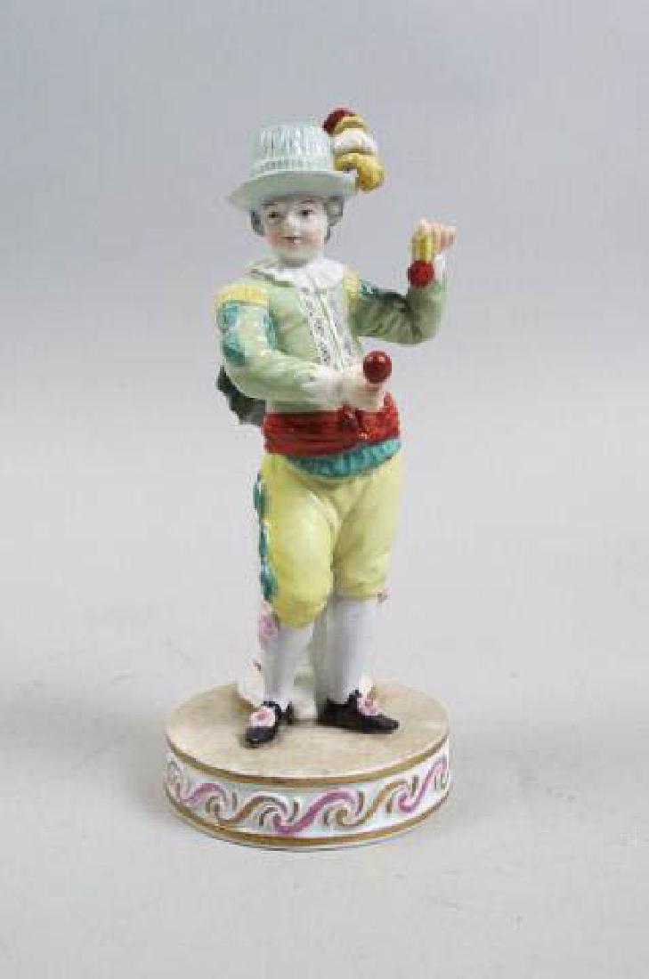 Meissen Porcelain Figurine of Young Boy,: holding musical instruments (?), 6 1/4" tall, crossed swords mark.