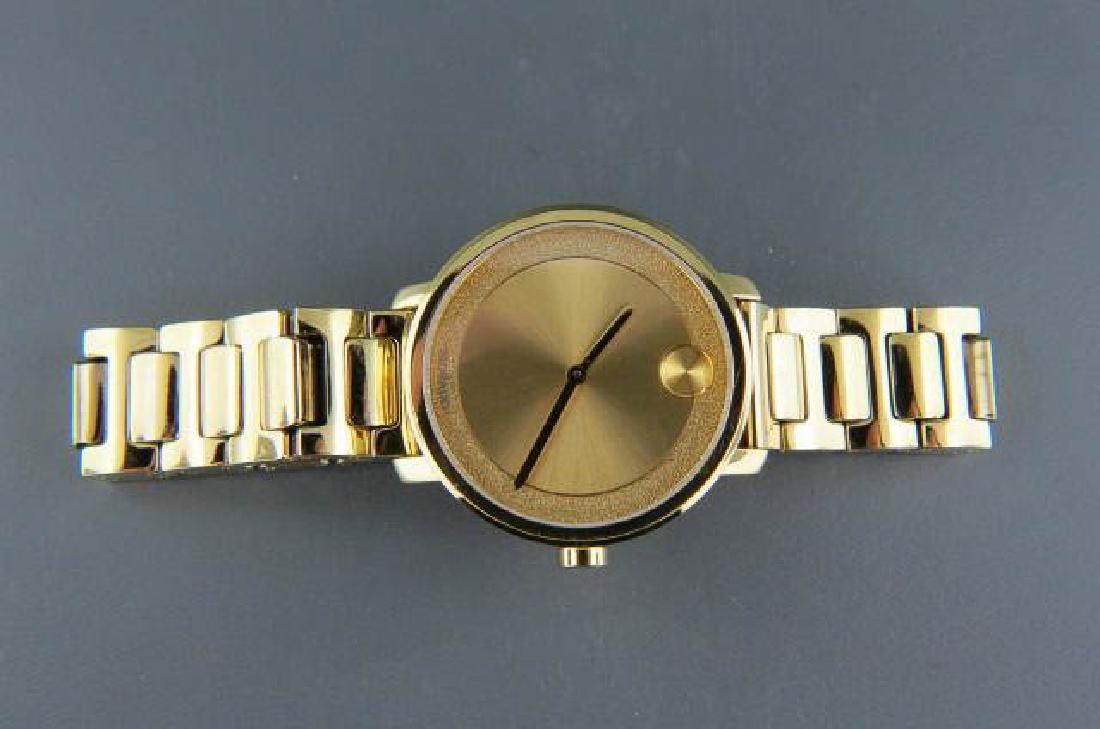 Movado Man's Wrist Watch,: Bold series, 34mm case, yellow gold ion-plated stainless steel, appears unused, still has sticker, was $595.00
