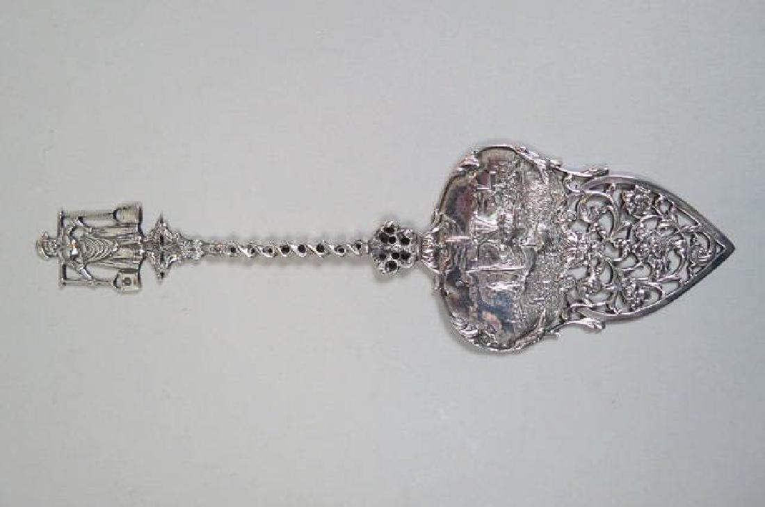 Elaborate Dutch Silver Pie or Cake Server,: harbor scene, farm maiden on handle, reticulated, hallmarked, 9 3/4" long, circa 1890, excellent, no monogram, 71 grams.