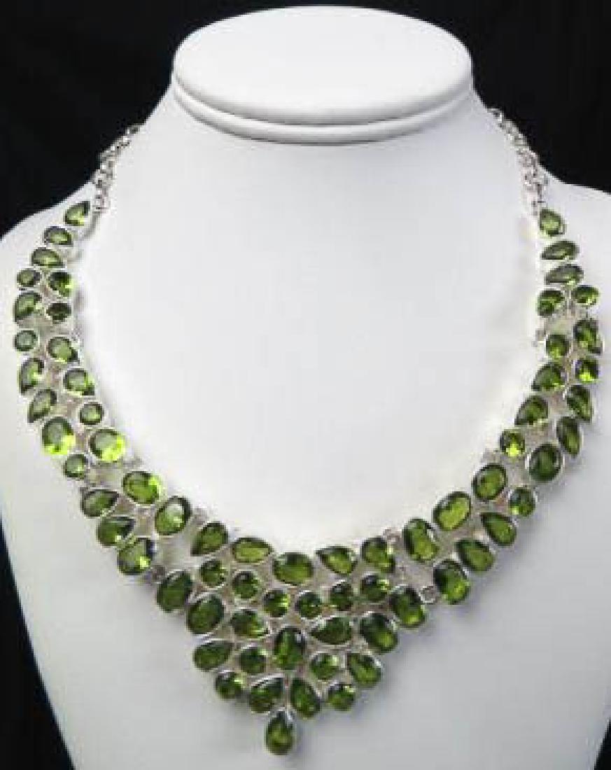 Peridot & Sterling Silver Necklace,: approx. 80 vivid gems in various shapes, up to 18" long, toggle clasp, stunning.