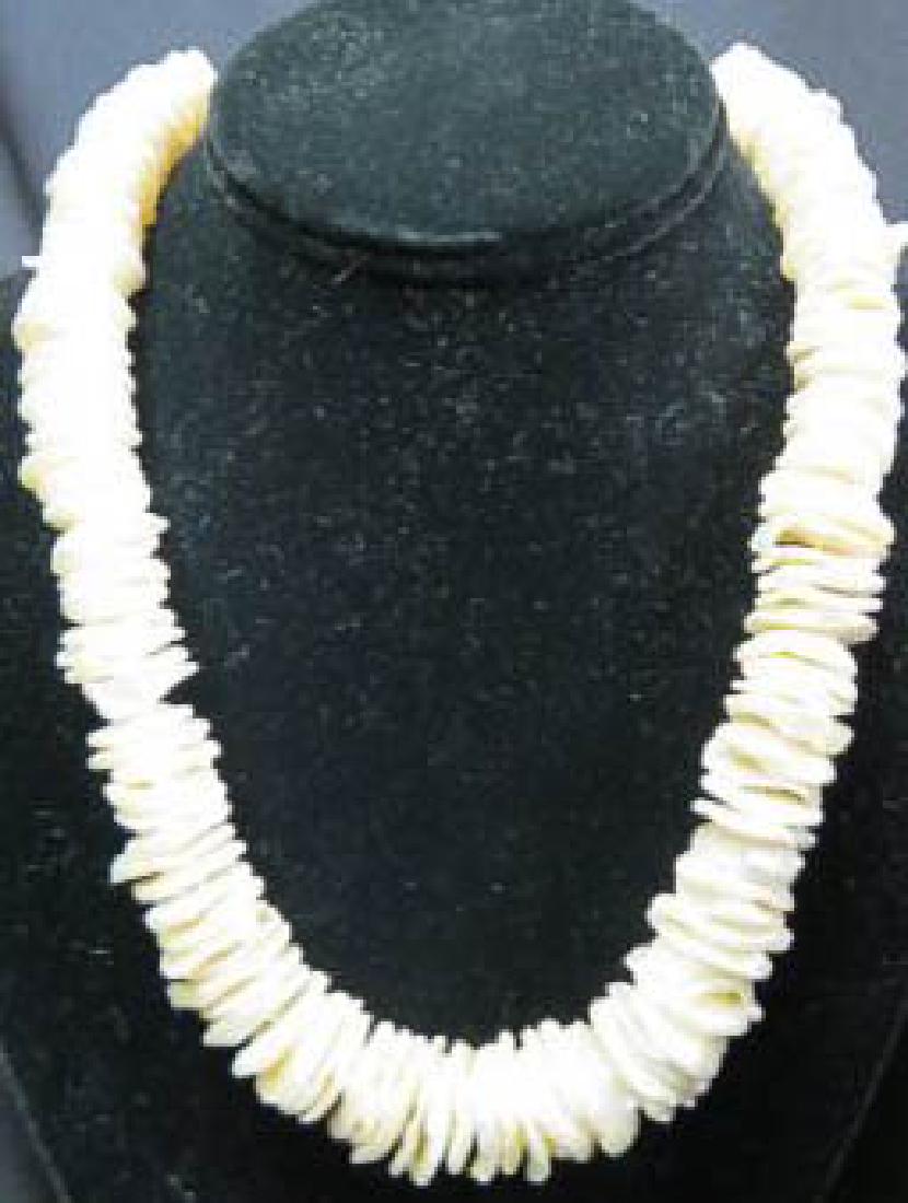 Pearl Necklace,: luster flat keshi style pearls, up to 20" long.