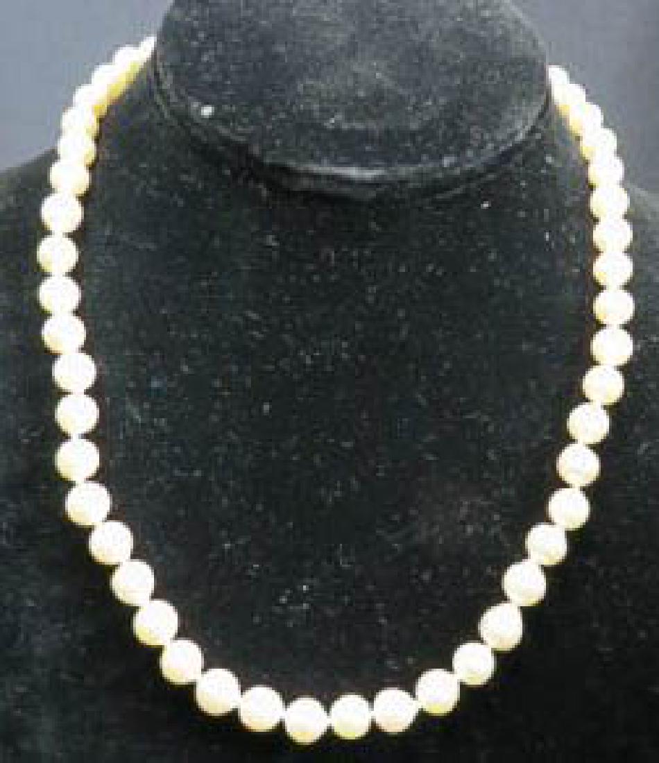 Pearl Necklace,: 52 pearls 7.4 to 7.8mm, fine cream rose color, 18k yellow gold box clasp, with appraisal of $1550.00, 17" long.