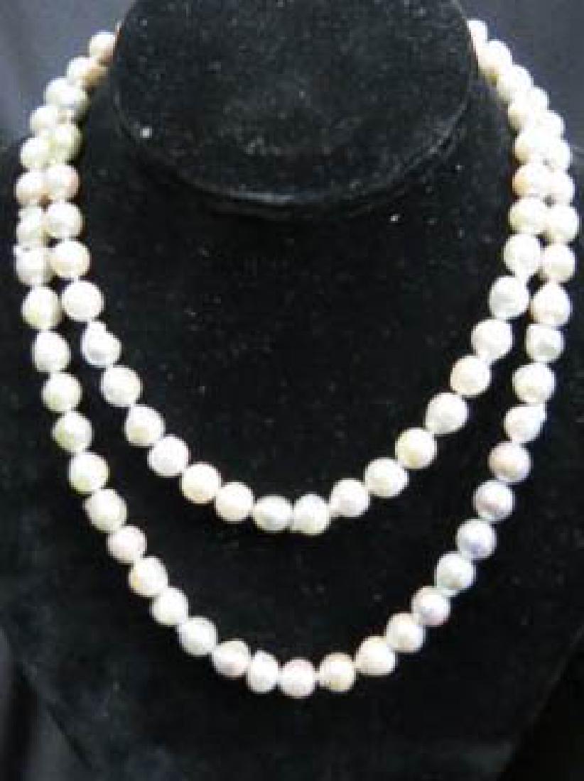 Pearl Necklace with 14K Gold Clasp,: 91 silver blue baroque pearls, opera length, 14k yellow gold clasp, with appraisal of $2820.00, 35.4" long.