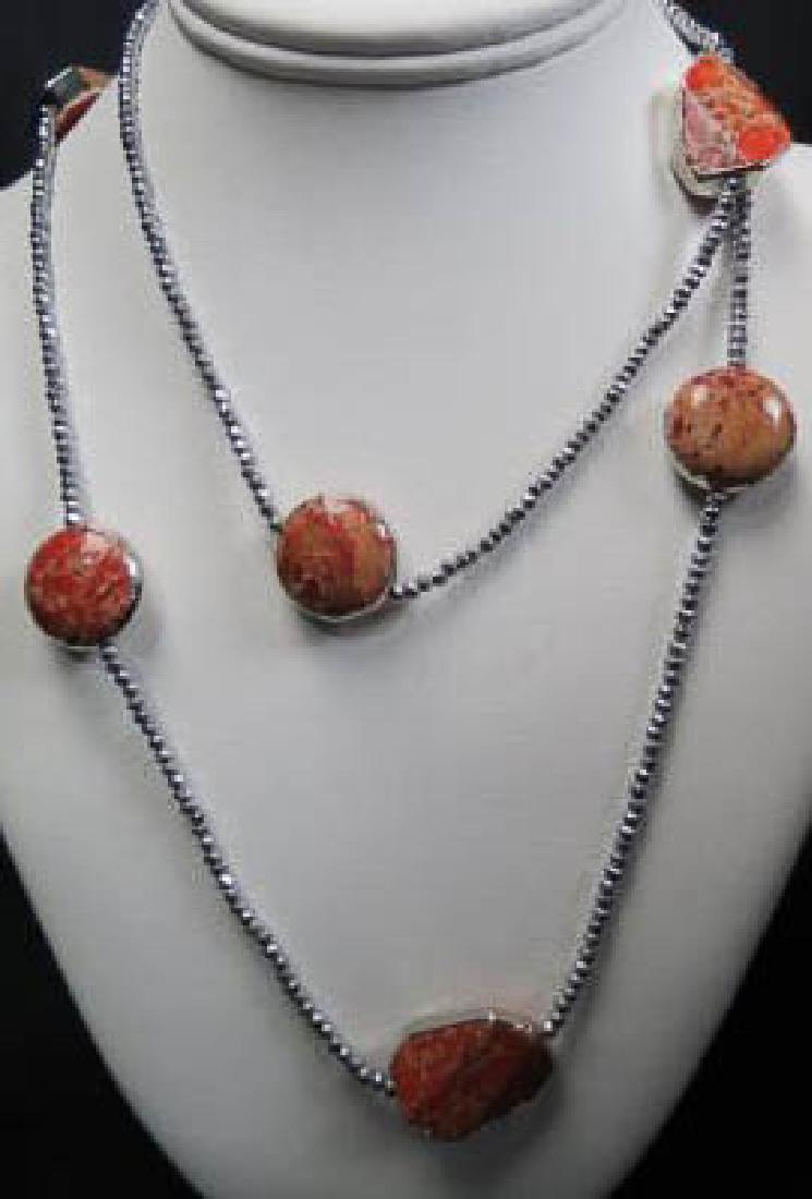 Red Coral & Hematite Bead Necklace,: 7 natural style medallions of coral, sterling clasp, 40" long.