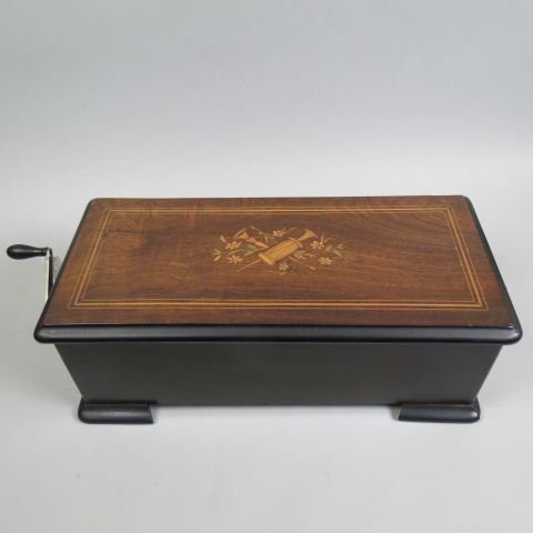 Mermod Freres Swiss Cylinder Music Box, 8 tunes,: with original tune card, tune indicator, Jacot's safety check dated 1886, serial number 54622, 9" cylinder, inlaid case with musical instruments and flowers, 10" X 21 1/2" plus external crank, working