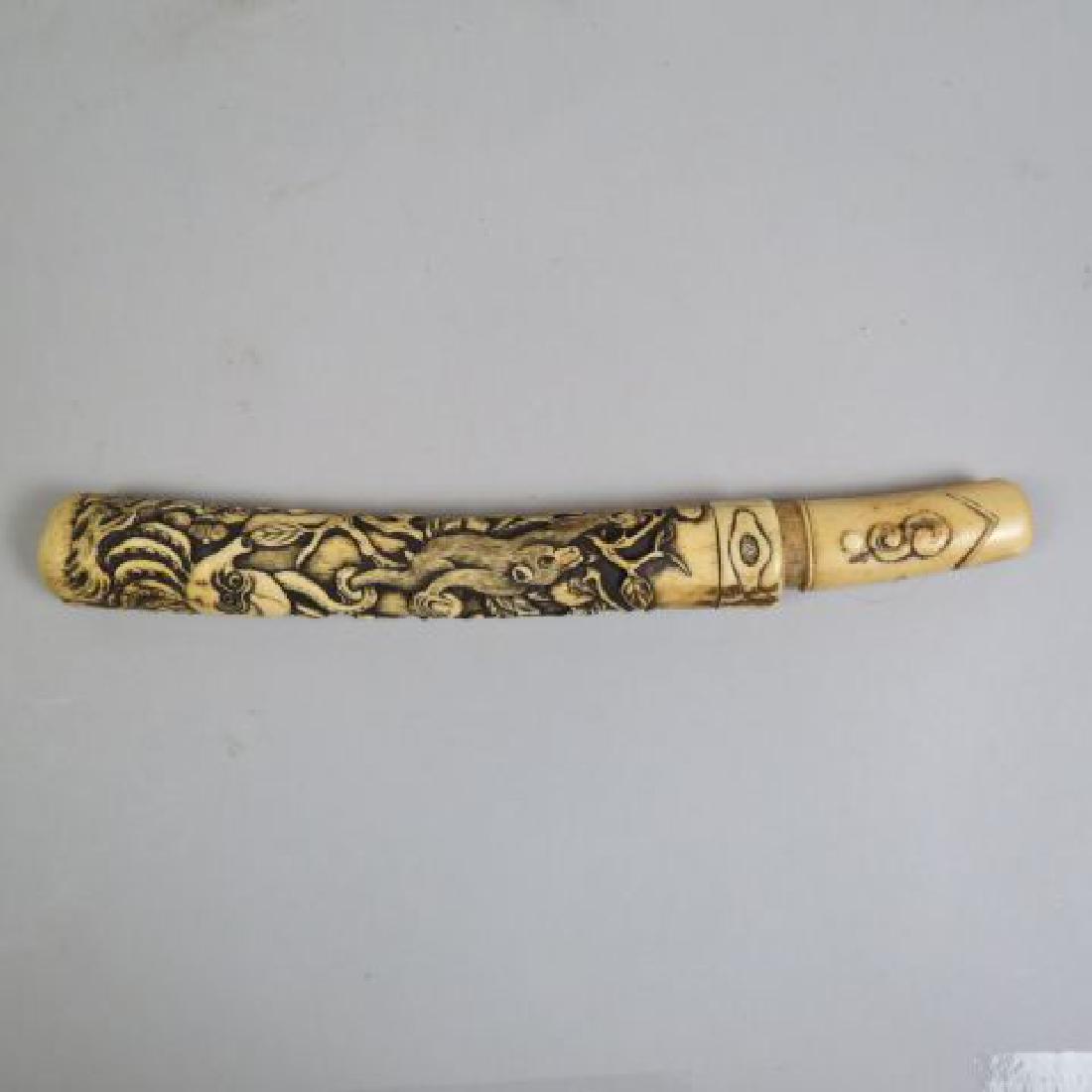 Japanese Carved Bone Tanto,: fine carving of monkey picking fruit with an octopus attacking his leg, 11" long, 5 3/4" blade.....Japanese Tanto knives (or short swords) are characterized by their dagger-like design. The tanto knif