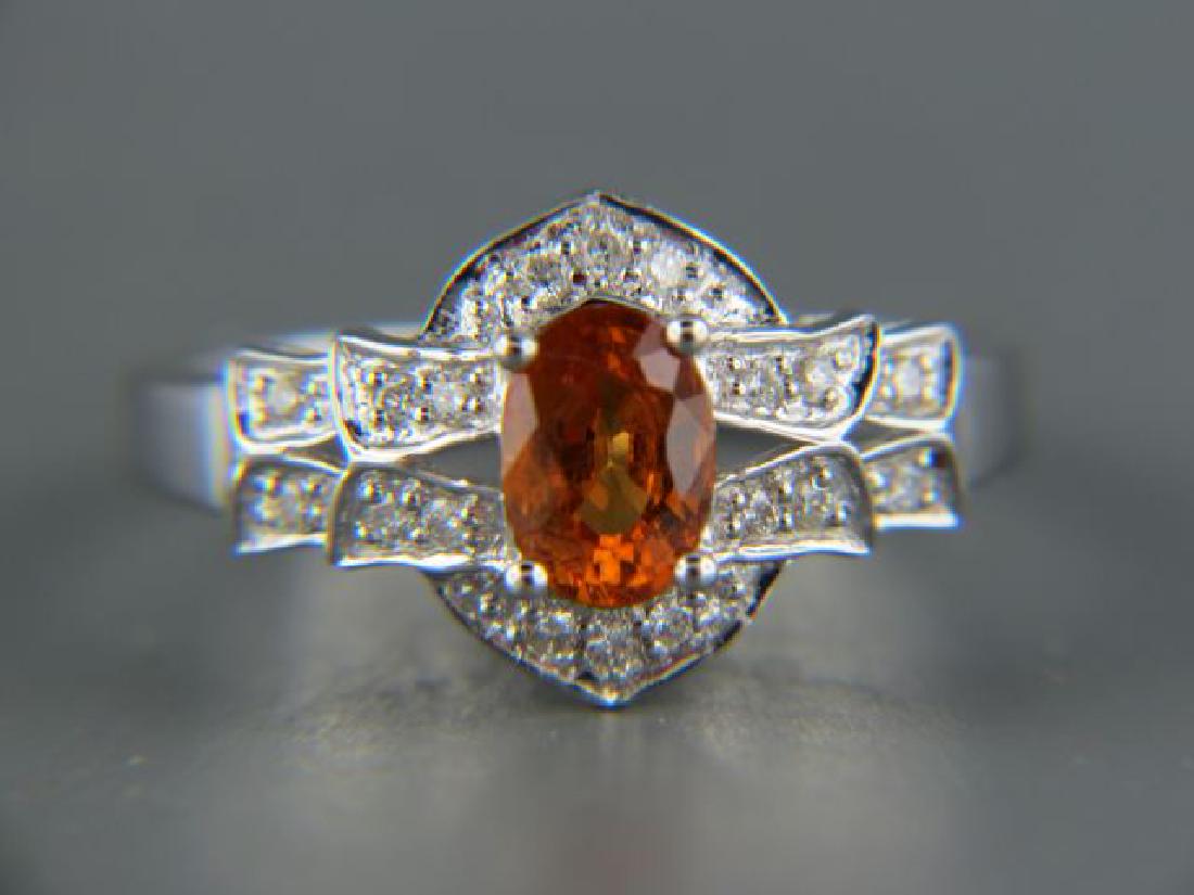 Spessartite Garnet & Diamond 14k Gold Ring,: rich oval gem weighing 1.17 carat surrounded by round diamonds totaling .16 carat in 14k white gold, currently size 7