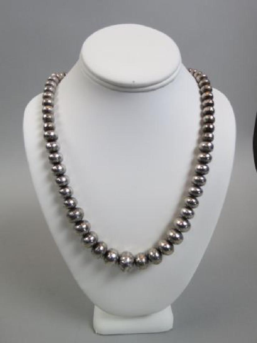 Navajo Indian Silver Bead Necklace,: oval with flower design, 24" long, 74 grams