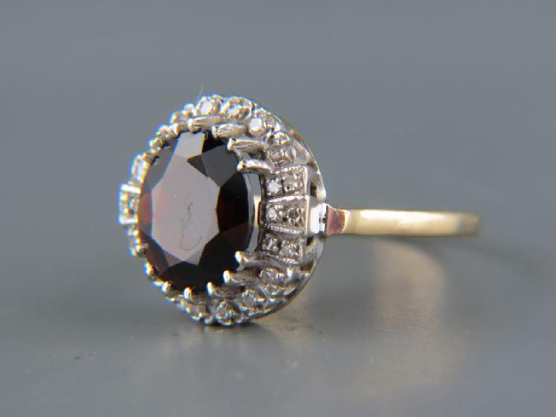 Garnet & Diamond Ring,: deep rich oval gems weighing approx. 4 carats surrounded by round diamonds in 14k yellow & white gold, currently size 9