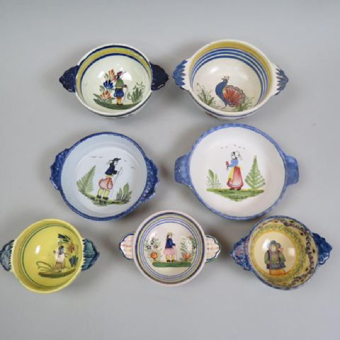 7 Quimper French Pottery Handled Bowls,: various designs, 4" to 5 1/2"..Quimper pottery has a long history. Tin-glazed, hand-painted pottery has been made in Quimper, France, since the late seventeenth century. The earliest firm, founded in 