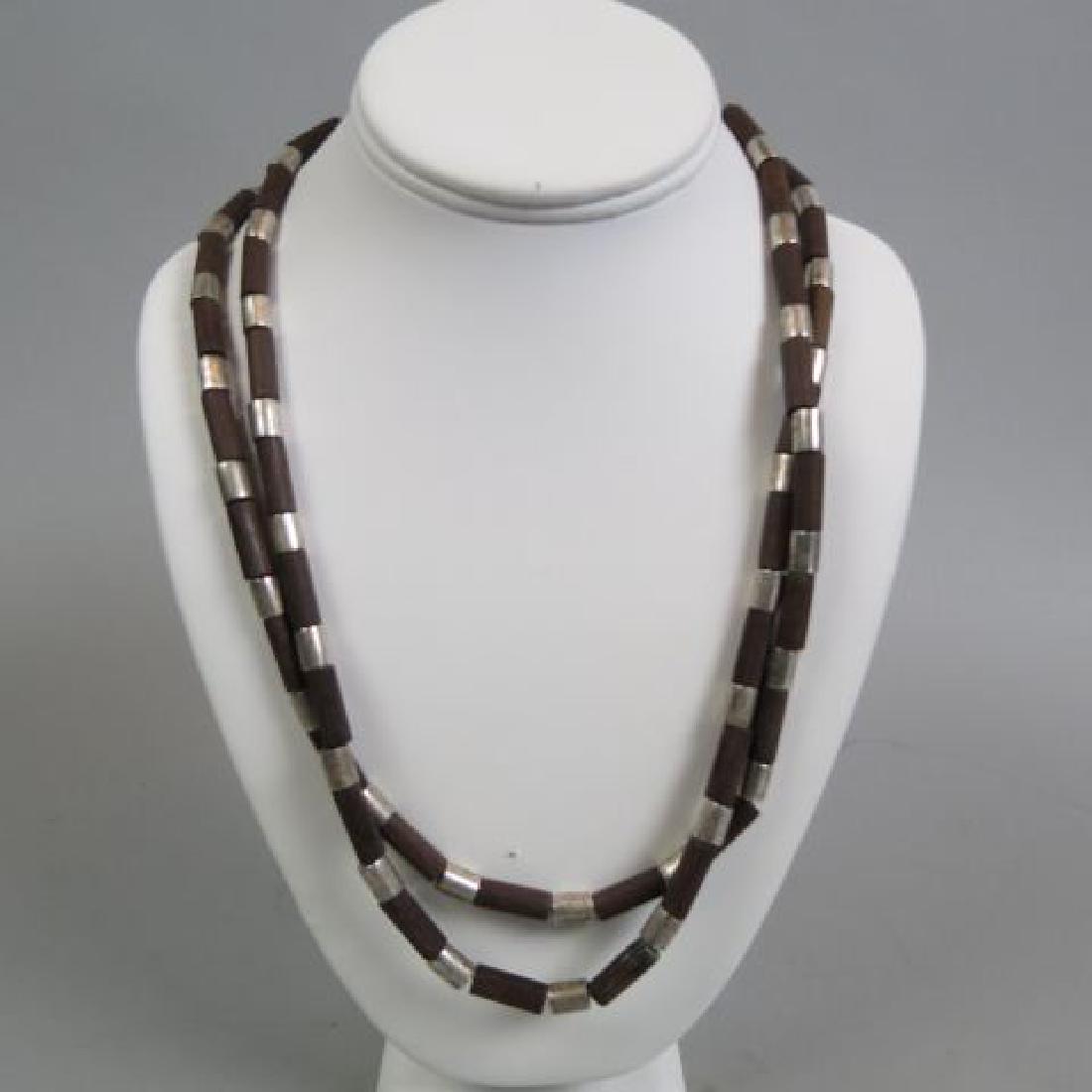 William Spratling Sterling & Wood Bead Necklace,: elongated beads, famous Taxco maker, 50" long.....Biography from The Columbus Museum of Art, GeorgiaWilliam Spratling was born to an Alabama-bred father and a New England mother in 1900 in upstate New