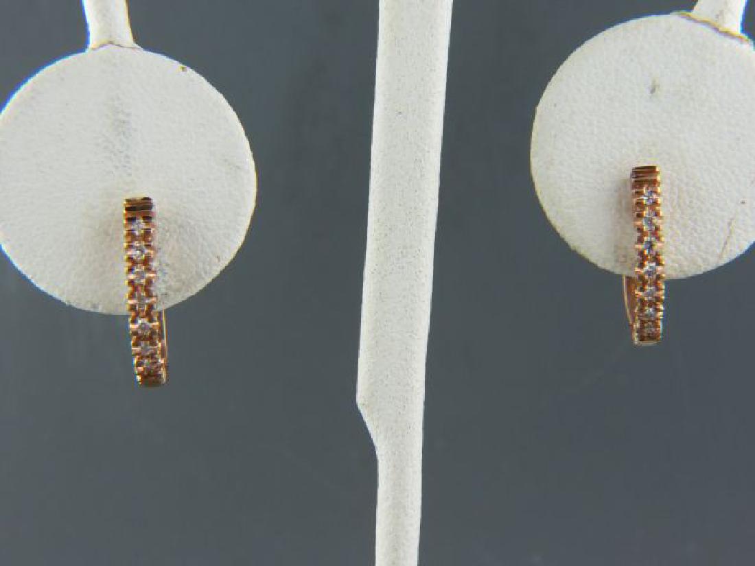 Diamond 14k Gold Earrings,: 7 round diamonds in each, .14 carat total, hinged huggie style, 14k rose color gold, 5/8" long