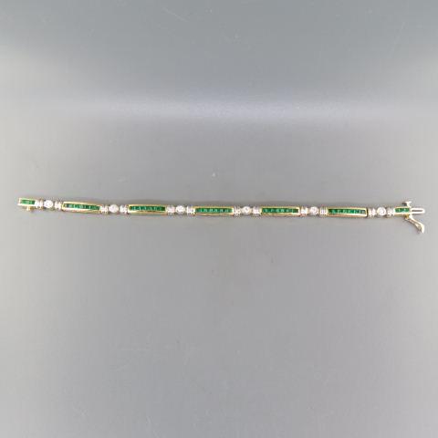 Emerald & Diamond Bracelet,: 41 square cabibre cut emeralds totaling 2.05 carats and 6 round diamonds totaling .50 carat in 14K yellow gold, with appraisal of $2,850.00 7" long.
