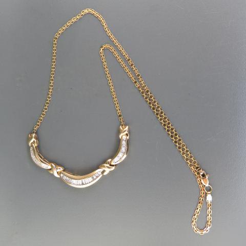 Diamond Necklace,: 52 tapered baguette diamonds totaling 1.15 carats in 14K yellow gold, with appraisal of $2480.00, 19" long.