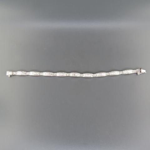 Diamond 14K Gold Bracelet with 342 Diamonds,: 216 are round and 126 baguette shape, total 7 carats, high grade, white gold, with appraisal of $14,000.00, 7" long.