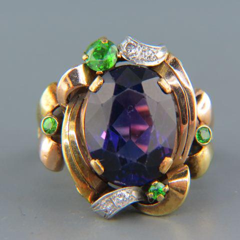 Amethyst, Tsavorite & Diamond Ring,: Art Deco rose and yellow gold setting with a vivid amethyst weighing 9.12 carats and four Tsavorite garnets weighing 1.24 carats plus four round diamonds totaling .08 carat all in heavy 14K gold, with