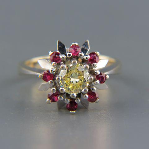 Fancy Light Yellow Diamond & Ruby Ring,: round diamond weighing .60 carat surrounded by eight round rubies totaling .65 carat in 14K white gold Art Deco floral setting, with appraisal of $3,750.00, currently size 7.