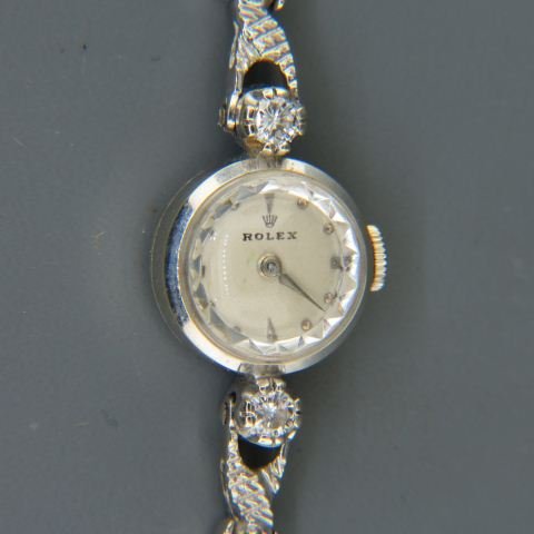 Rolex Diamond 14K Gold Ladies Wristwatch, dress model,: with 17 round diamonds totaling .30 carats, 14K white gold, 15 mm case, 6 1/4\" long, 14.1 grams.