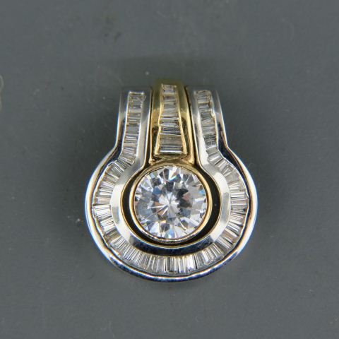 Diamond Pendant with 60 Baguette Diamonds: totaling 1.64 carats surrounding a 3.5 carat cubic zirconia, 14K yellow and white gold, with appraisal of $2,155.00, 7/8" long.