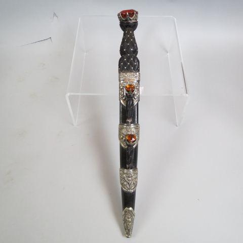 Scottish Dirk with carved wood handle and jewels,: faux citrines, nickel silver thistle decor, leather sheath, fine quality, overall 17 1/2" long, hallmarked......The Scottish Dirk was a direct descendent of the Medieval ballock dagger. The grip form 
